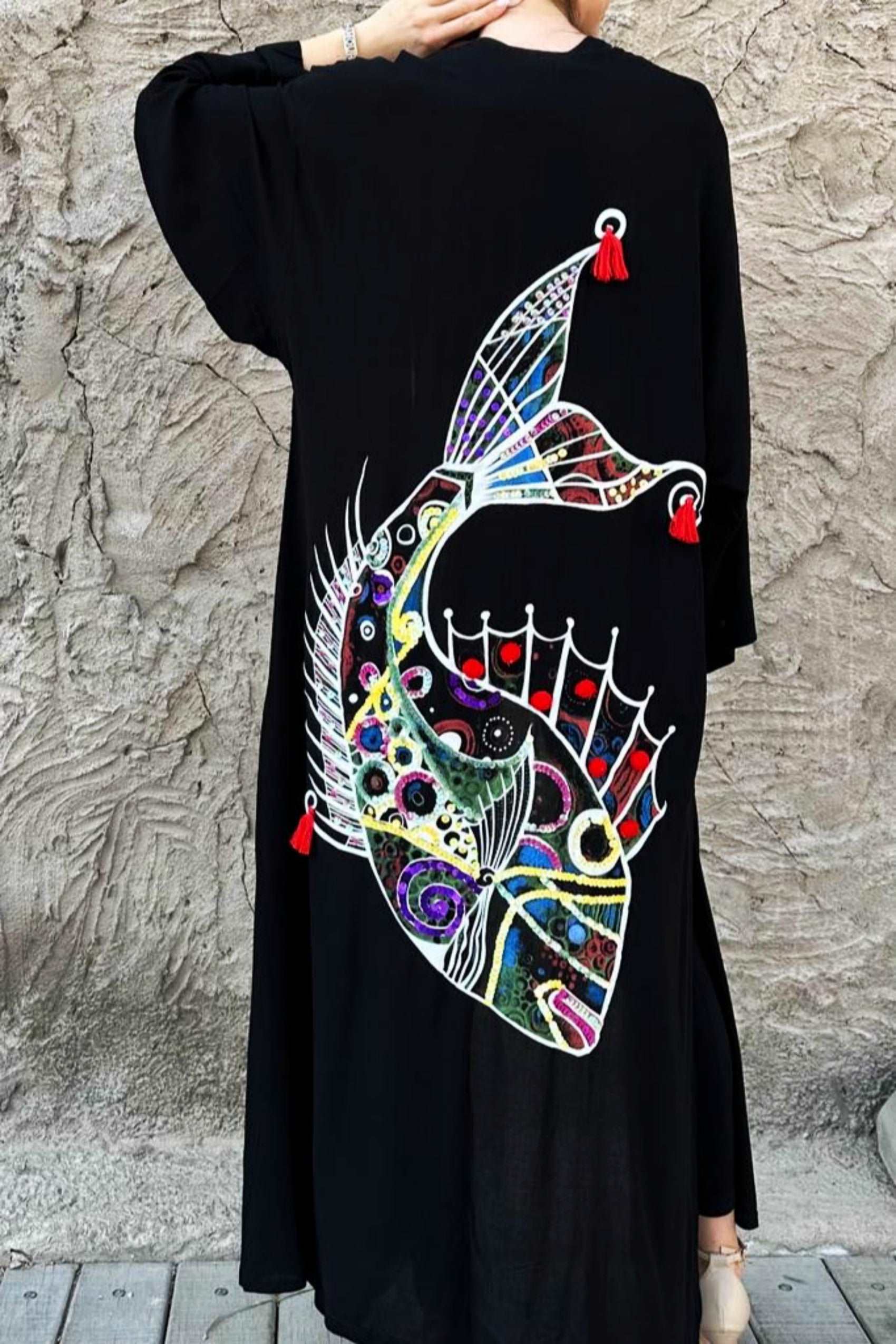 Black abaya with hand-painted colorful fish at the back